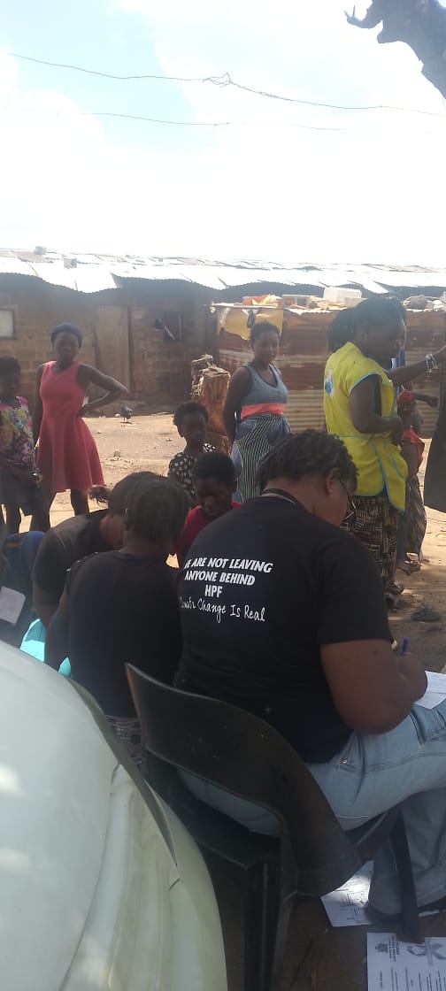 Health Planet Foundation volunteers speaking with community members