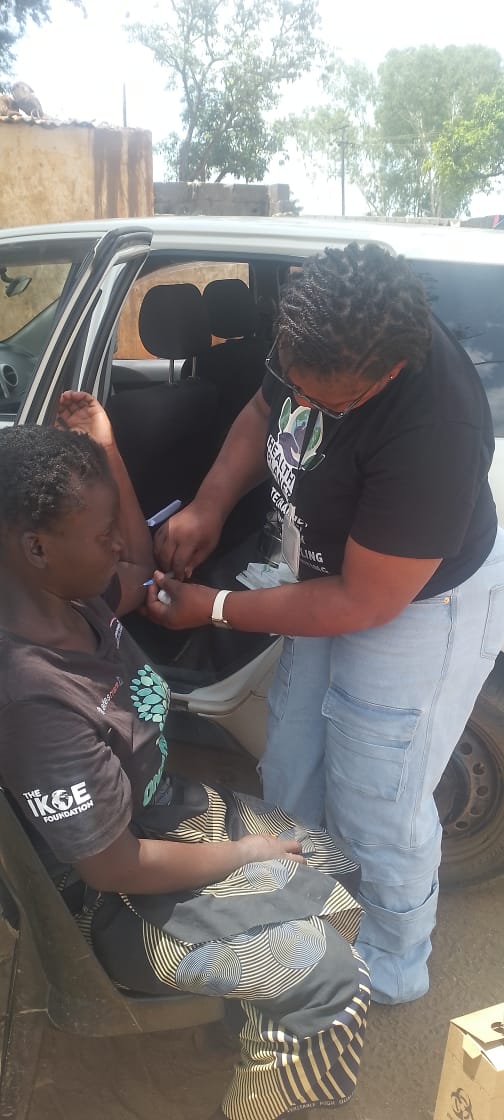 Team member demonstrating handwashing and water safety materials