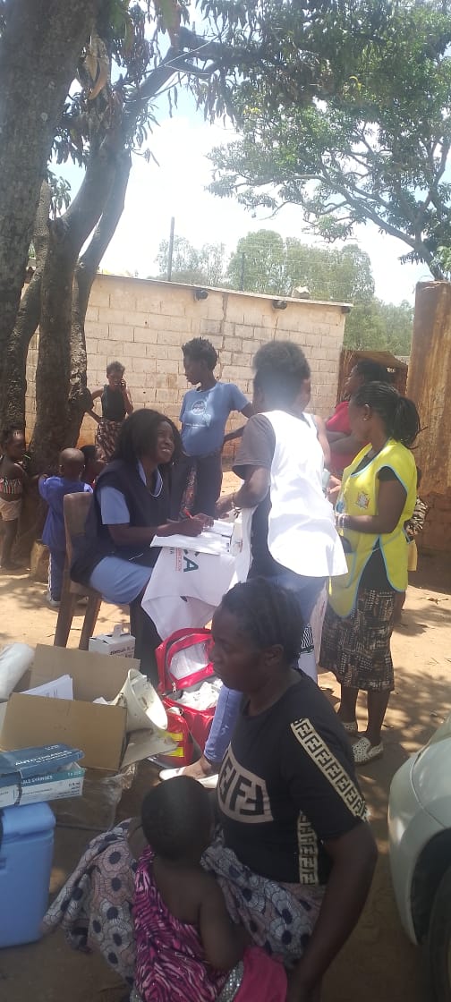Community members receiving support during an outdoor session