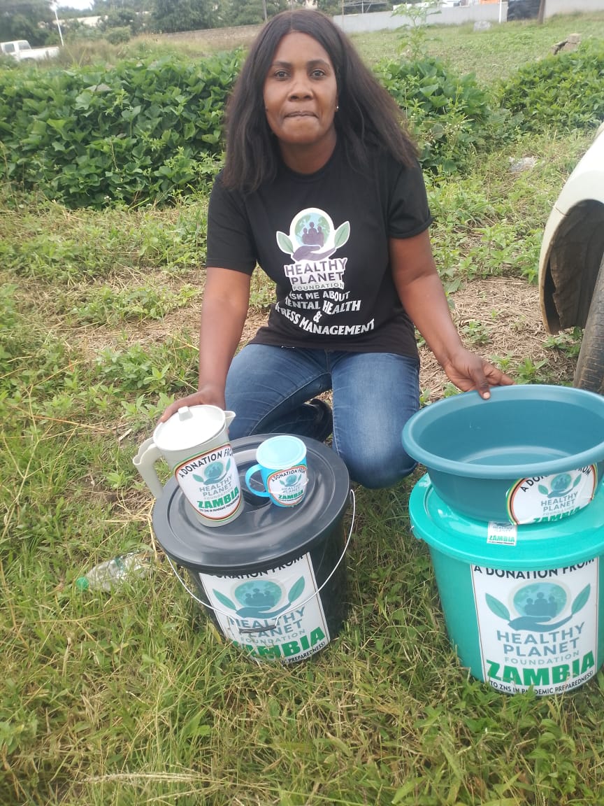 Team member holding program supplies for community outreach