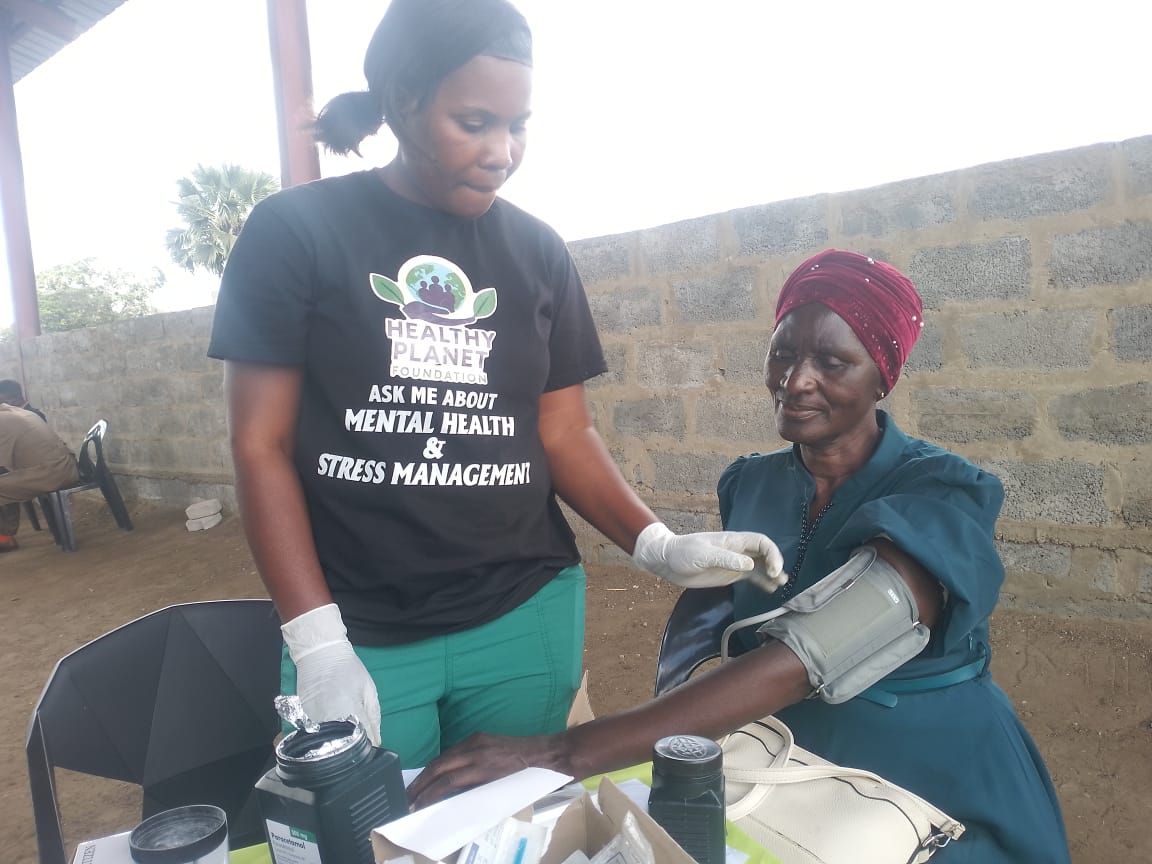 Health Planet Foundation team member supporting a community health activity