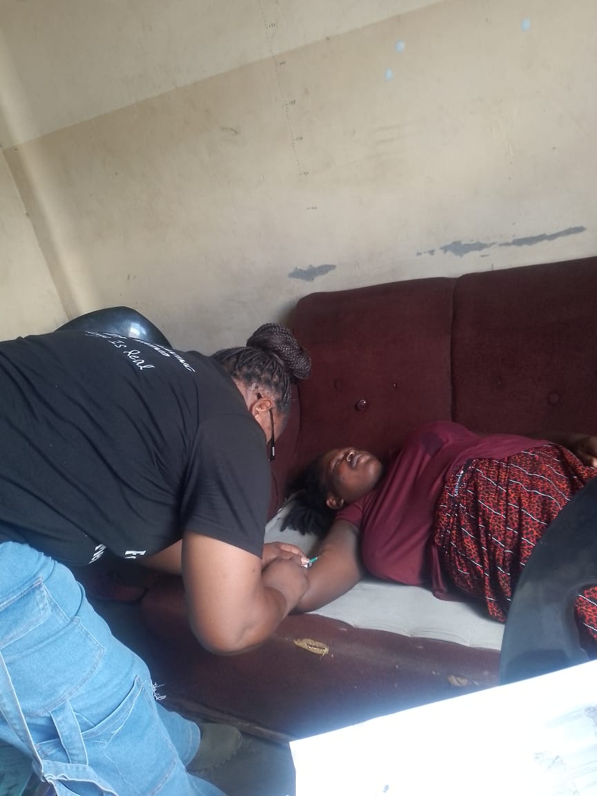 Health Planet Foundation volunteer supporting bedside care